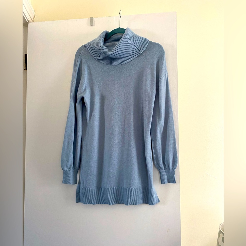 Light blue cowl necked sweater.